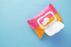 pink and orange packet of wipes - a common cause of blocked drains